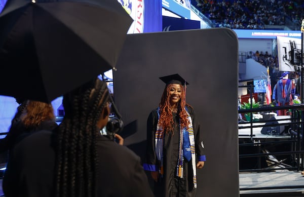 Summer Clark poses for a photo after walking across the stage during the Georgia State University J. Mack Robinson College of Business morning graduation ceremony at the Georgia State Convocation Center in Atlanta on Thursday, May 2, 2024. (Natrice Miller/ AJC)