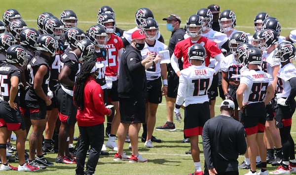 Falcons head coach Arthur Smith (center) addresses the offense and defense for instruction during rookie minicamp Friday, May 14, 2021, in Flowery Branch. (Curtis Compton / Curtis.Compton@ajc.com)