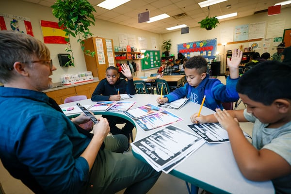 Fourth-grade teacher Jeremy Lowe works with a group of students during a reading class at Parkside Elementary School in Atlanta on Thursday. Miguel Martinez/AJC