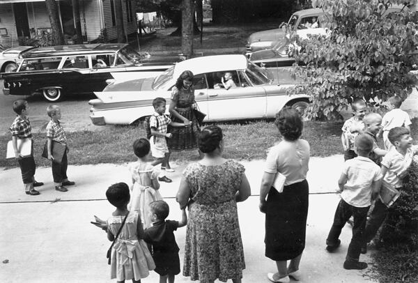 June Campbell walks with her son, William Campbell, to school on Sept. 7, 1960. William Campbell was the first Black student to integrate schools in Raleigh, N.C. He later became mayor of Atlanta. (The News & Observer files)