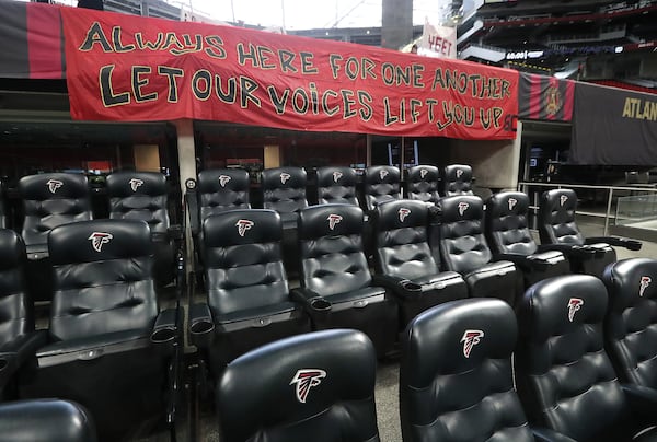 The stands are void of fans for the Atlanta United match against Nashville SC in Mercedes-Benz Stadium, but a fan banner still reads "let our voices lift you up" on Saturday, Aug. 22, 2020, in Atlanta. (Curtis Compton/Atlanta Journal-Constitution/TNS)