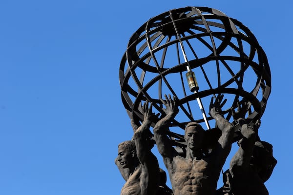 The World Athletes Monument, also known as the Prince Charles Monument or Prince of Wales Monument, sits at Pershing Point in Midtown Atlanta where Peachtree Street and West Peachtree Street converge. The monument, dedicated to the 1996 Summer Olympics, was a gift from the Prince of Wales. 
 BEN GRAY / BGRAY@AJC.COM
