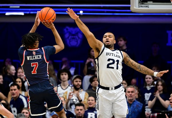 St. John's guard Simeon Wilcher (7) shoots the ball over Butler ath Dante Maddox Jr. (21) during the first half of an NCAA college basketball game, Wednesday, Feb. 26, 2025, in Indianapolis, Ind. (AP Photo/Marc Lebryk)