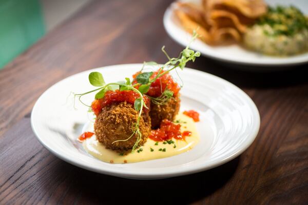 Lump Crab fritters with lemon, hollandaise, and pepper jelly.