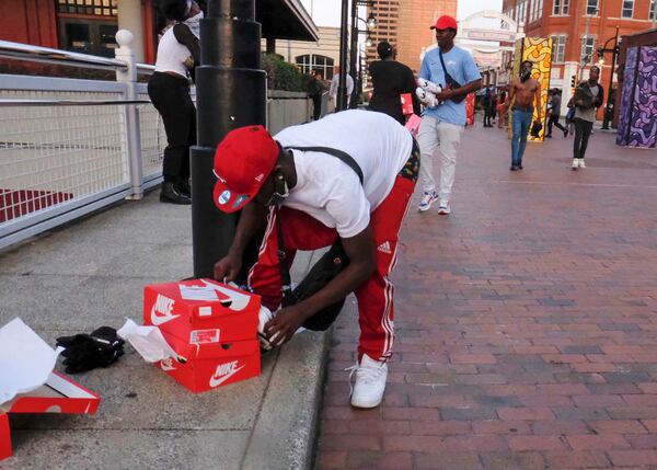 Looters steal from a Foot Locker Store  in downtown Atlanta as protests continued for a fourth day.  Protests over the death of George Floyd in Minneapolis police custody continued around the United States, as his case renewed anger about others involving African Americans, police and race relations.