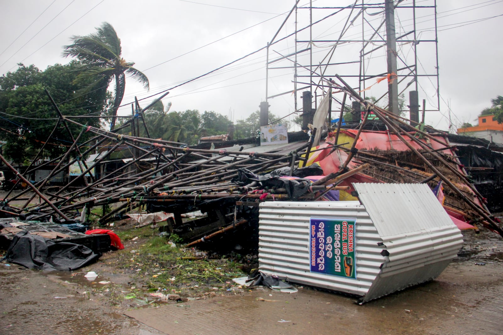 An overturned tin shed and other debris is strewn on a road on the coast of Bay of Bengal in Balasore district of Odisha state, on India's eastern coastline, where Tropical Storm Dana made landfall late Thursday night, according to the Indian Meteorological Department, India, Friday, Oct. 25, 2024. (AP Photo)