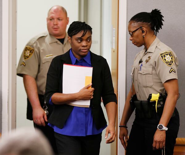  Tiffany Moss arrives in court for the first day of her death penalty trial on April 24, 2019.  Moss, who is representing herself, declined to make an opening statement.