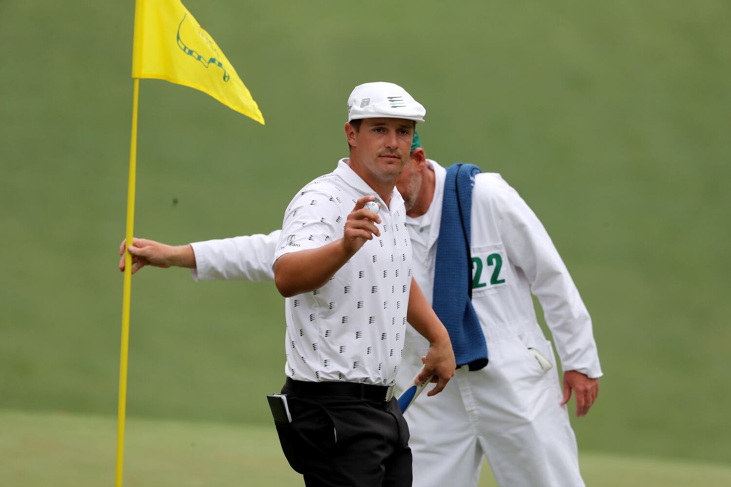 April 8, 2021, Augusta: Bryson DeChambeau reacts to the gallery as he makes a par putt on the tenth hole during the first round of the Masters at Augusta National Golf Club on Thursday, April 8, 2021, in Augusta. Curtis Compton/ccompton@ajc.com