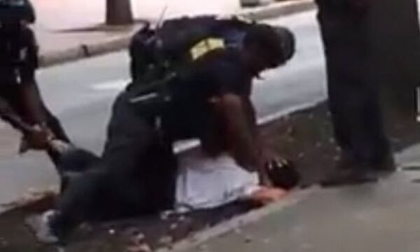 Video that shows an Atlanta police officer punching a man in the head. (Credit: Facebook)