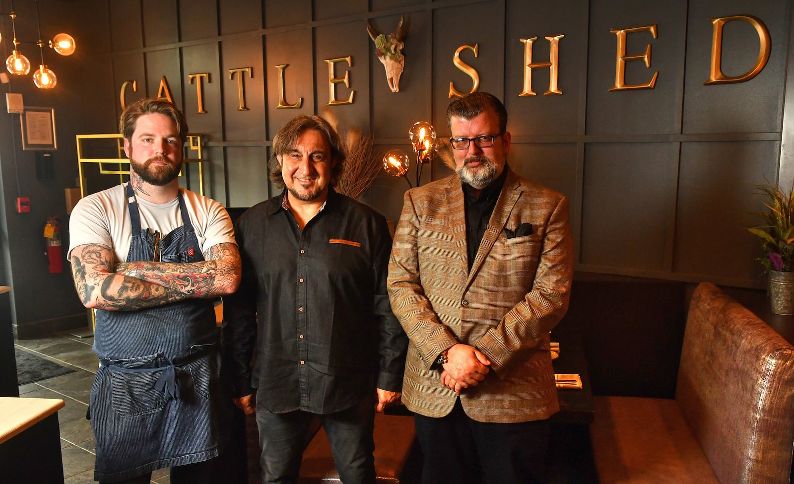 The team at Cattle Shed Wine & Steak Bar includes (from left) executive chef Colin McGowan, owner Sean Yeremyan and general manager Chris Reid. (Chris Hunt for The Atlanta Journal-Constitution)