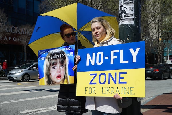 Protesters gather to raise awareness about the plight of children in the war in Ukraine and to call for the establishment of a no-fly zone over the country at a rally held in downtown Atlanta on Saturday, March 19, 2022.