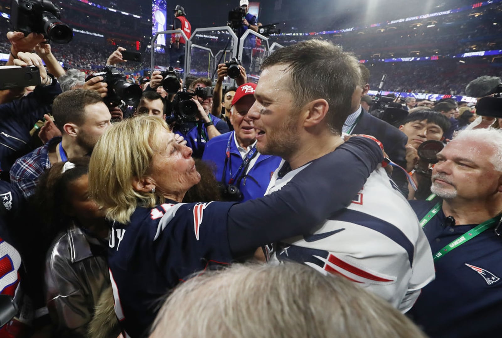 Tom Brady #12 of the New England Patriots hugs his mother Galynn after the Patriots defeat the Los Angeles Rams 13-3 during Super Bowl LIII at Mercedes-Benz Stadium on February 3, 2019 in Atlanta, Georgia. (Photo by Jamie Squire/Getty Images/TNS)