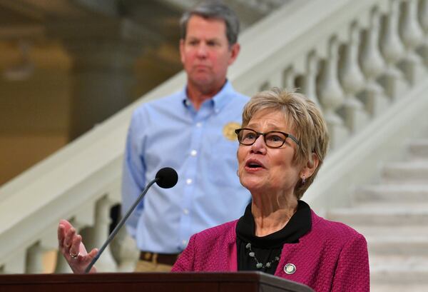 Dr. Kathleen Toomey, commissioner of Georgia Department of Public Health, speaks as Governor Brian Kemp looks during a press briefing to update on COVID-19 at the Georgia State Capitol on Tuesday, May 12, 2020. HYOSUB SHIN / HYOSUB.SHIN@AJC.COM