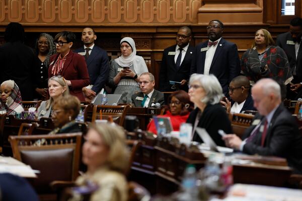 Multiple State Rep. listen to State Rep. James Burchett, R-Waycross, sponsor of the SB68, speaks during a debate before a vote on Thursday, March 20, 2025 in Atlanta. (Miguel Martinez /Atlanta Journal-Constitution via AP)