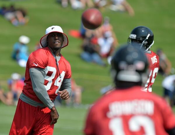 HBO should dedicate one camera to Roddy White if they want some hilarious stuff. He's a funny guy. Here, White throws to fellow receiver Darius Johnson during mini-camp Tuesday June 17, 2014. BRANT SANDERLIN /BSANDERLIN@AJC.COM