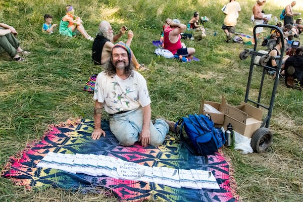 Poet Stephen Wing gave away copies of his book at the Rainbow Family of Living Light Gathering which took place for eth first time in Georgia at Chattahoochee National Forest from july 1 to july 7, 2018. (Cynthia Herms/CynthiaHerms.com)