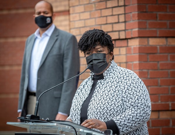 Atlanta Public Schools Superintendent Lisa Herring talks at a news conference at M. Agnes Jones Elementary School in Atlanta on Monday as school board Chairman Jason Esteves looks on.  STEVE SCHAEFER FOR THE ATLANTA JOURNAL-CONSTITUTION