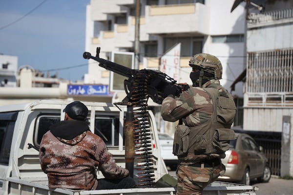 Reinforcement Syrian security forces deploy in Latakia, Syria, Friday, March 7, 2025. (AP Photo/Omar Albam)