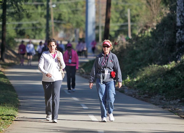 Kimberly Liedigk of Johns Creek (left) and Celine Ostheimer of Canton walk along a section of the Stone Mountain Trail in downtown Clarkston.