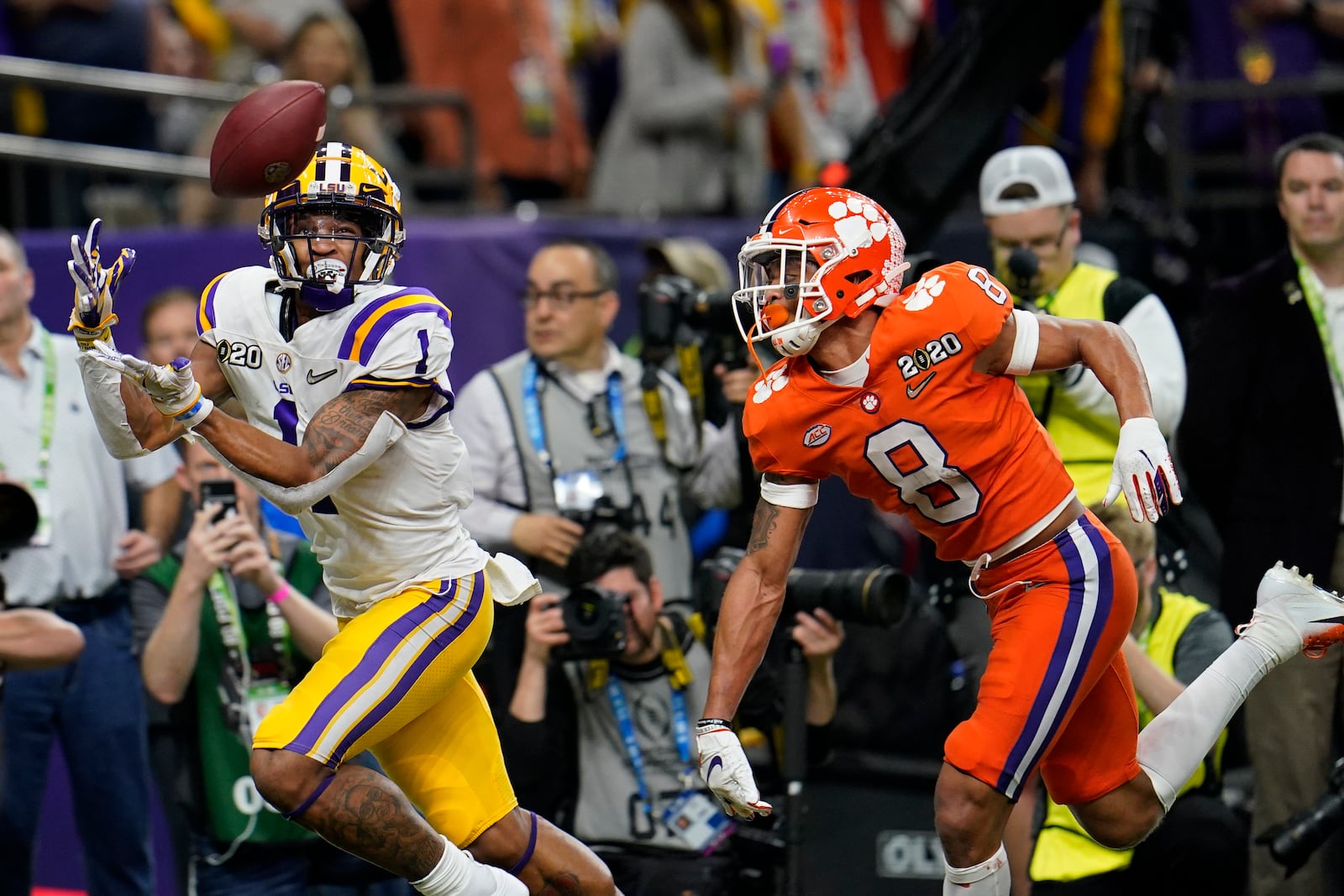 LSU wide receiver Ja'Marr Chase catches a touchdown pass in front of Clemson cornerback A.J. Terrell during the first half of a NCAA College Football Playoff national championship game Monday, Jan. 13, 2020, in New Orleans. (AP Photo/David J. Phillip)