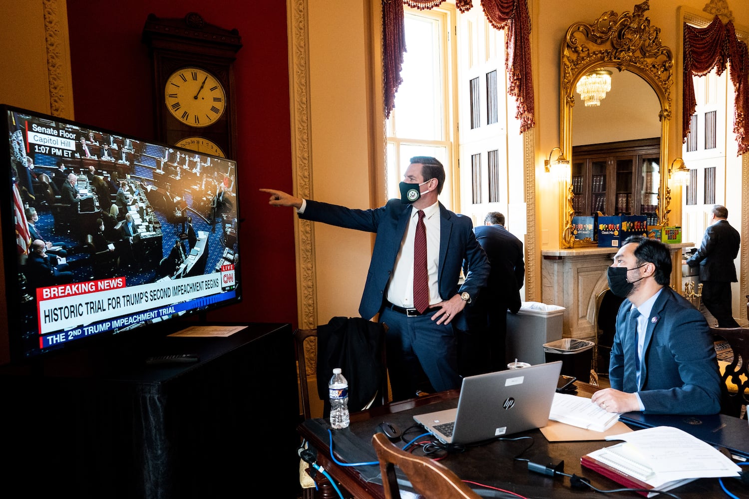 House impeachment managers Rep. Eric Swalwell (D-Calif.) and Rep. Joaquin Castro (D-Texas), seated, watch the first day of the Senate impeachment trial of former President Donald Trump, at the Capitol in Washington on Tuesday, Feb. 9, 2021. The second impeachment trial of former President Trump is scheduled to began on Tuesday, about a month after he was charged by the House with incitement of insurrection for his role in egging on a violent mob that stormed the Capitol on Jan. 6. (Erin Schaff/The New York Times)