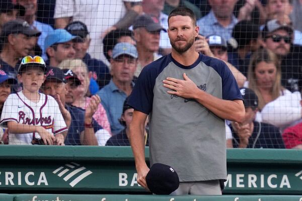 Atlanta Braves pitcher Chris Sale acknowledges Red Sox fans at the top of the second inning of a baseball game, Tuesday, June 4, 2024, at Fenway Park in Boston. Sale pitched for the Sox from 2017-2023. (AP Photo/Charles Krupa)