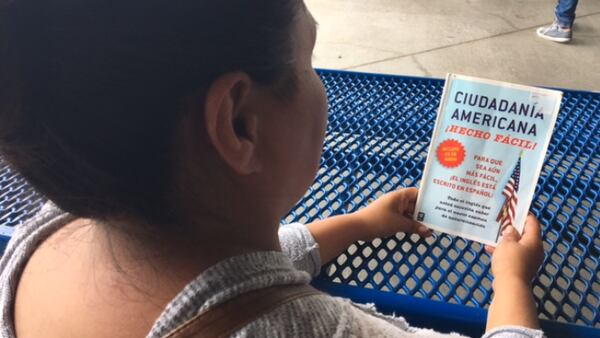 Maria Resendiz, a 45-year-old mother from Hidalgo, Mexico uses weathers Hurricane Irma at Forest Hill High School storm shelter by studying for the American Citizenship exam. (Julio Poletti/The Palm Beach Post)