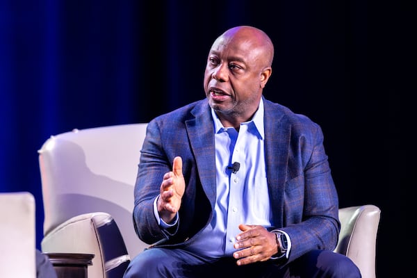 Republican presidential candidate Sen. Tim Scott, R-South Carolina, speaks to WSB radio host Erick Erickson at The Gathering conservative political conference in Buckhead on Friday, August 18, 2023. (Arvin Temkar / arvin.temkar@ajc.com)