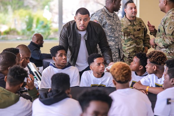 Benjamin Raymond talks to a group of boys at the mentoring camp sponsored annually by his father-in-law and popular talk show host and comedian Steve Harvey. Despite growing up with a drug-addicted mom and an absentee dad, Raymond became a successful entrepreneur. CONTRIBUTED BY DIALLO WASHINGTON