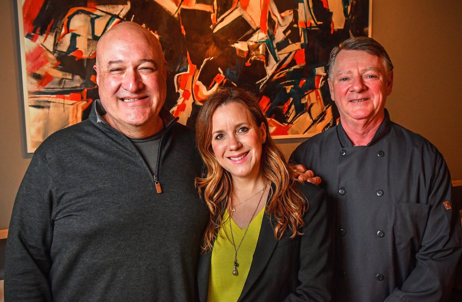 L-R: Executive chef, Jimmy Carey, Camille Olabarrieta, executive chef, Bobby Holley at Jimmy'z Kitchen in Marietta.  (Contributed by Chris Hunt Photography)