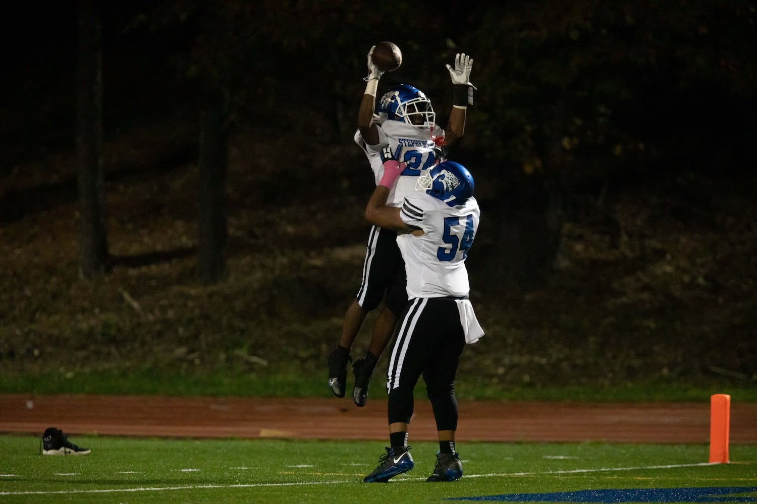 Stephenson's Devin Ingram (24) and Dakarai Smith (54) celebrate a touchdown during a GHSA high school football game between Stephenson High School and Miller Grove High School at James R. Hallford Stadium in Clarkston, GA., on Friday, Oct. 8, 2021. (Photo/Jenn Finch)