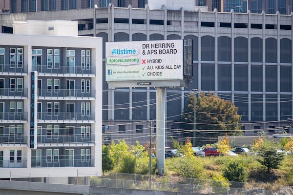 A billboard urging Atlanta Public Schools to give parents more options to send their child back to in-person classes is displayed in Midtown Atlanta on October 1, 2020.  (Alyssa Pointer / Alyssa.Pointer@ajc.com)