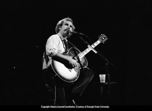 Jimmy Buffett performs during a campaign event for President Jimmy Carter at the Fox Theatre, Atlanta, Sept. 27, 1980. (Kenneth Walker / AJC)