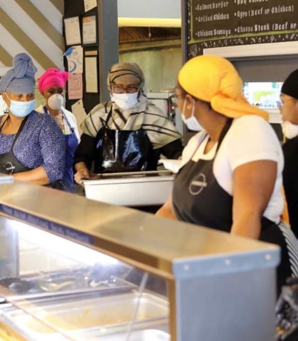 Servers at Springreens, which has been serving free meals with no questions asked for nearly a month as part of its Drive Thru Iftar program. COURTESY OF SPRINGREENS