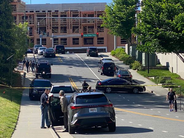 There is heavy police presence near The Battery Atlanta as Cobb police, along with Atlanta police and other local agencies, continue their search for the man suspected in a shooting in Midtown. May 5, 2023. (Adrianne Murchison)