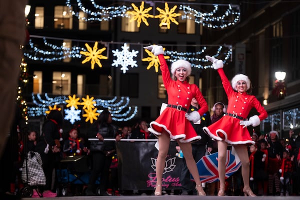 Dancers from the Off Center Project dance during the Christmas parade and tree lighting at Atlantic Station in Atlanta on Saturday, Nov. 23, 2024.   Ben Gray for the Atlanta Journal-Constitution