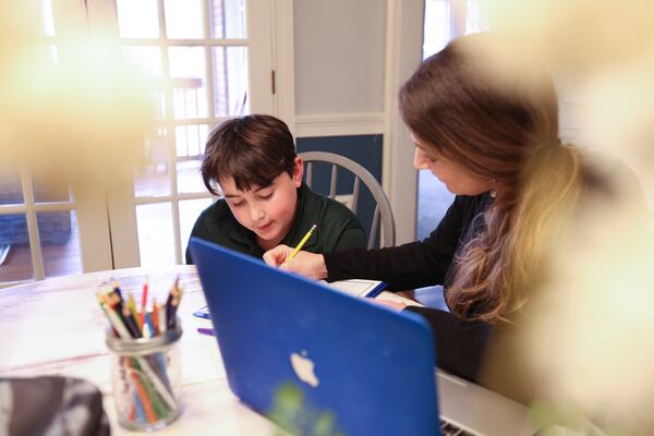 Former Gwinnett elementary school teacher Missy Purcell helps her son Matthew with after-school homework; they practice writing and reading. Matthew was diagnosed with dyslexia, which makes writing and reading difficult; Missy is one of the several advocates who has pushed the district to find better teaching technics to help students with dyslexia.Wednesday, January 26, 2022 Miguel Martinez for The Atlanta Journal-Constitution 