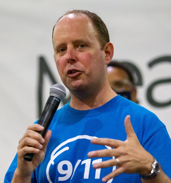 President and CEO of Hands On Atlanta Jay Cranman speaks to the volunteers during the opening ceremony of the 9/11 National Day of Service at the Georgia World Congress Center Saturday, September 11, 2021. During the event, hundreds of volunteers packed meals for the Atlanta Community Food Bank.  STEVE SCHAEFER FOR THE ATLANTA JOURNAL-CONSTITUTION