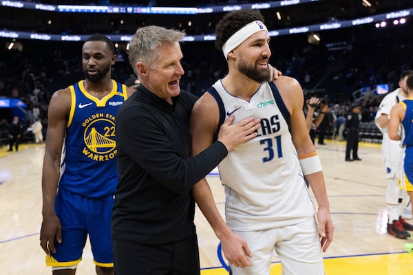 Golden State Warriors head coach Steve Kerr interacts with Dallas Mavericks guard Klay Thompson (31) after an NBA basketball game Sunday, Dec. 15, 2024, in San Francisco. (AP Photo/Benjamin Fanjoy)