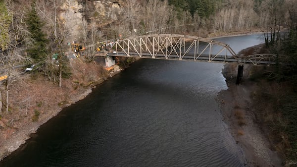 The Sandy River runs under the Stark Street Bridge as construction continues on the bridge on Thursday, Feb. 6, 2025, in Troutdale, Ore. (AP Photo/Jenny Kane)