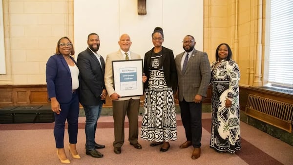 (L to R) NPU chair Stephanie Flowers, PY tenant and photographer Ty Pleas, Annie E. Casey Foundation, executive director Kweku Forstall, PY tenant Makeisha Robey and Colliers property managers Walter Slaton and Tameka Phillips.