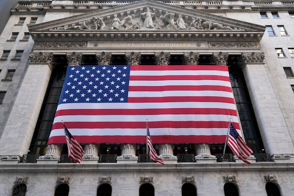 An American flag is displayed on the New York Stock Exchange in New York, Monday, Feb. 24, 2025. (AP Photo/Seth Wenig)