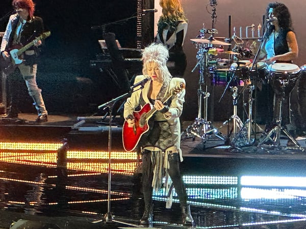 Cyndi Lauper played guitar for "Sisters of Avalon" during her farewell tour stop at State Farm Arena in Atlanta Nov. 10, 2024. RODNEY HO/rho@ajc.com