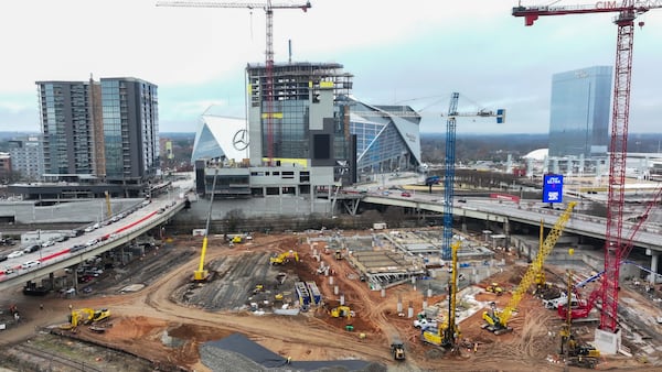 The Centennial Yards construction site is seen at full speed as the projects reach milestones. The Phoenix Hotel (center) reached the highest point in the structure on  Dec. 18. 
(Miguel Martinez/AJC)