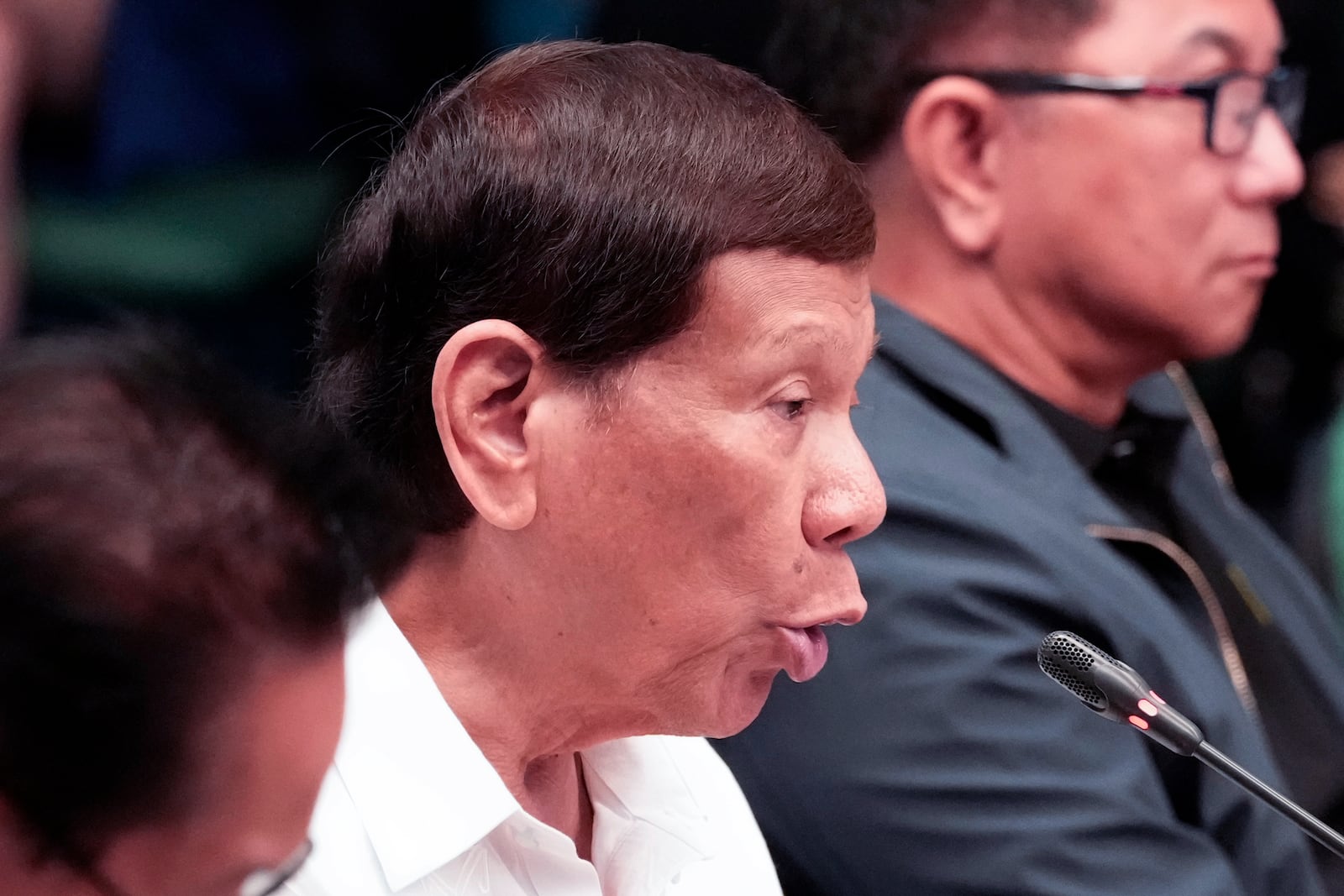 Former Philippine President Rodrigo Duterte gestures during a senate investigation on the war on the drugs during his administration, at the Philippine Senate, Monday, Oct. 28, 2024, in Manila, Philippines. (AP Photo/Aaron Favila)