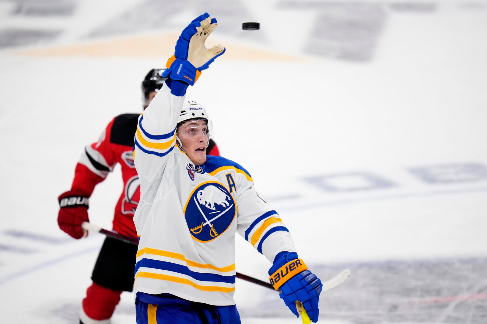 Buffalo Sabres' Tage Thompson catches the puck during the NHL hockey game between Buffalo Sabres and New Jersey Devils, in Prague, Czech Republic, Saturday, Oct. 5, 2024. (AP Photo/Petr David Josek)