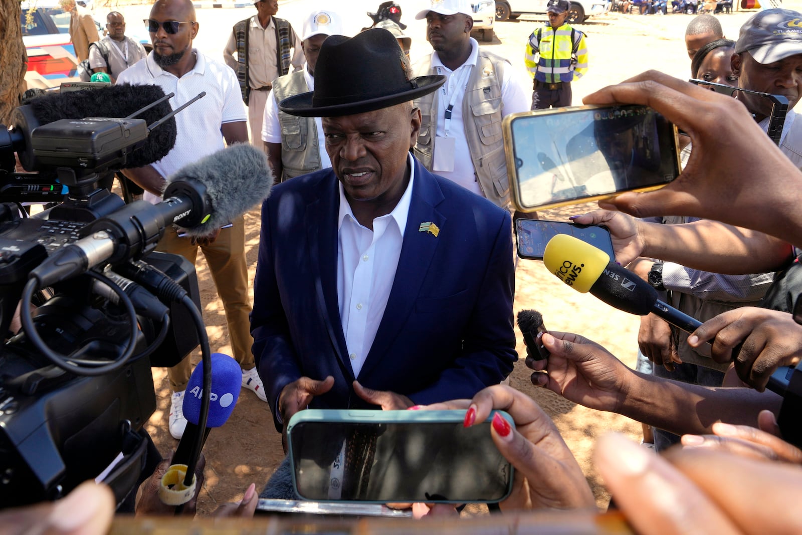 Botswana Democratic Party president Mokgweetsi Masisi speaks to journalists after casting his vote during the elections at Mosielele primary school in Moshupa village, Southern District of Botswana, Wednesday, Oct. 30, 2024. (AP Photo/Themba Hadebe)