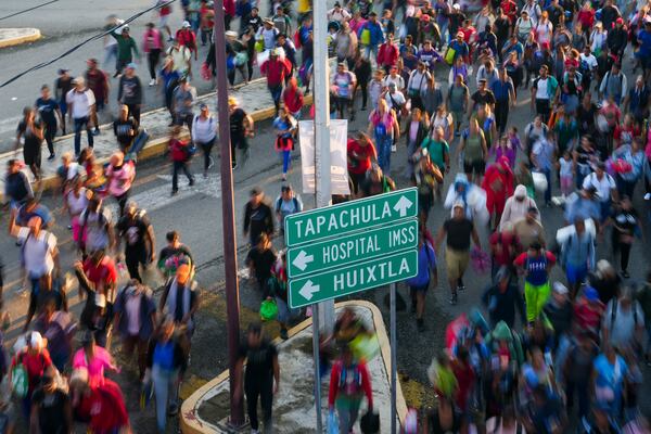 Migrants depart Tapachula, Mexico, hoping to reach the country's northern border and ultimately the United States, Tuesday, Nov. 5, 2024. (AP Photo/Moises Castillo)