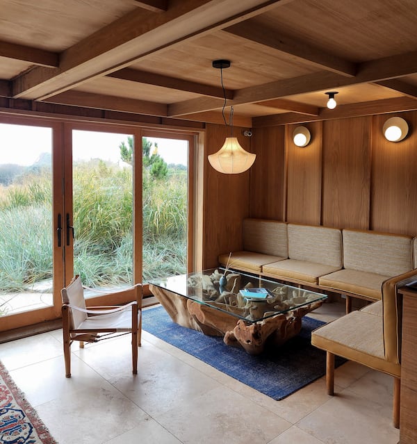 Few things add warmth to a room like wood. A coffee table made from a tree connects even more to the beautiful ocean landscape of Montauk, New York.
(Courtesy of Ingrid Weir)