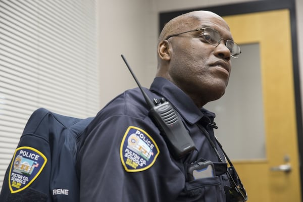 Riverwood International Charter School police officer Donald Rene talks about his time on the force while sitting in a conference room at that school in Sandy Springs on Tuesday, April 17, 2018. Officer Rene has been a police officer for more than 20 years. ALYSSA POINTER/ALYSSA.POINTER@AJC.COM